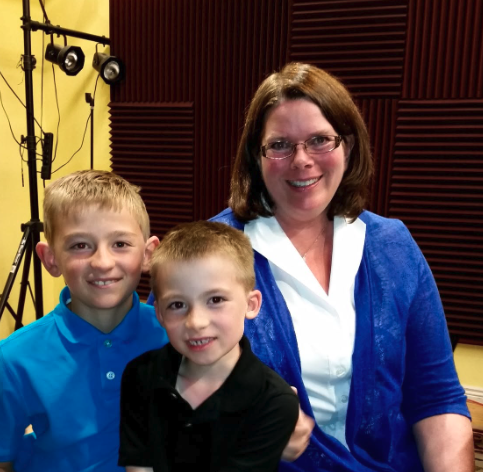 Dr. Albrecht with two young students